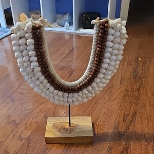 White and Brown Beaded Necklace on Stand